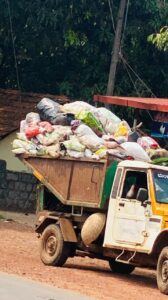 Lorry picking up plastic waste in India