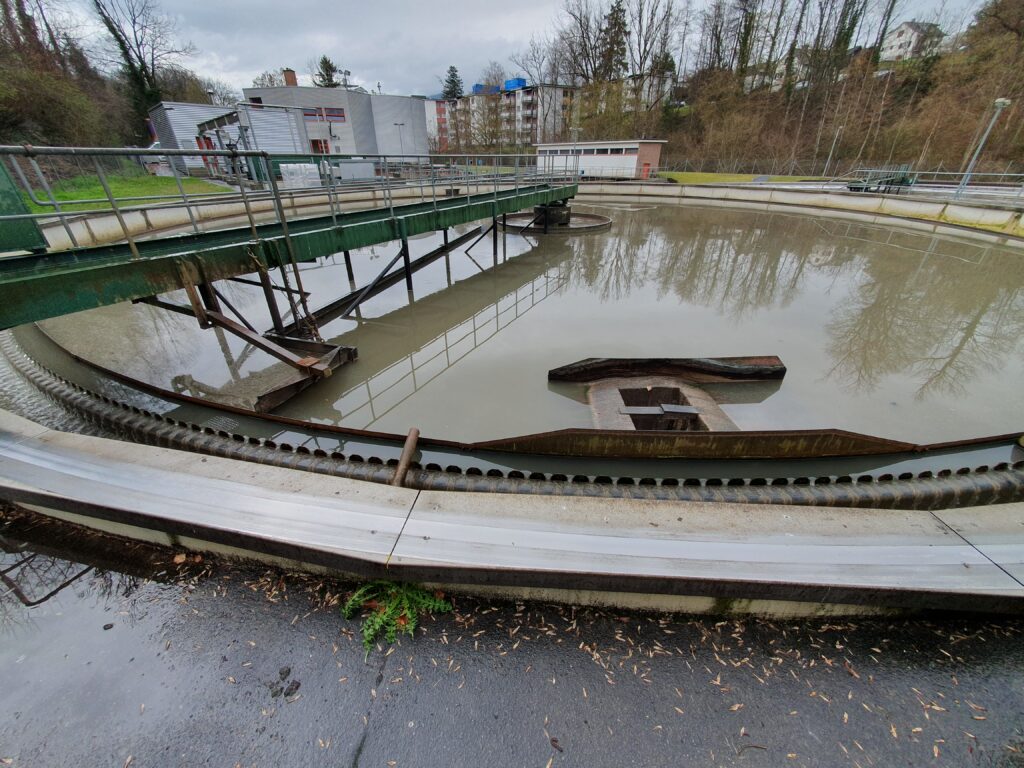Primary clarifier - a large, round cleaning basin - in a wastewaster treatment plant