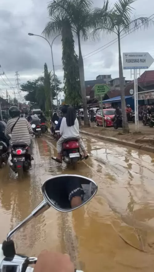 Motorcycles on a flodded road